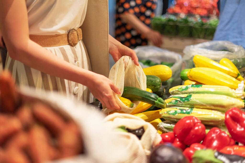 Shopper choosing fresh produce at a local market
